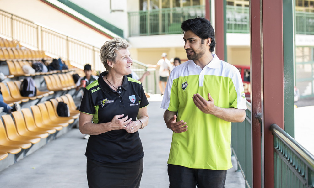 Man with woman discussing internship opportunities.